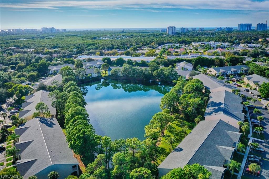 1220 Sarah Jean Circle, Unit L103 Naples, FL 34110 - Photo 22 of 23 an aerial view of a city