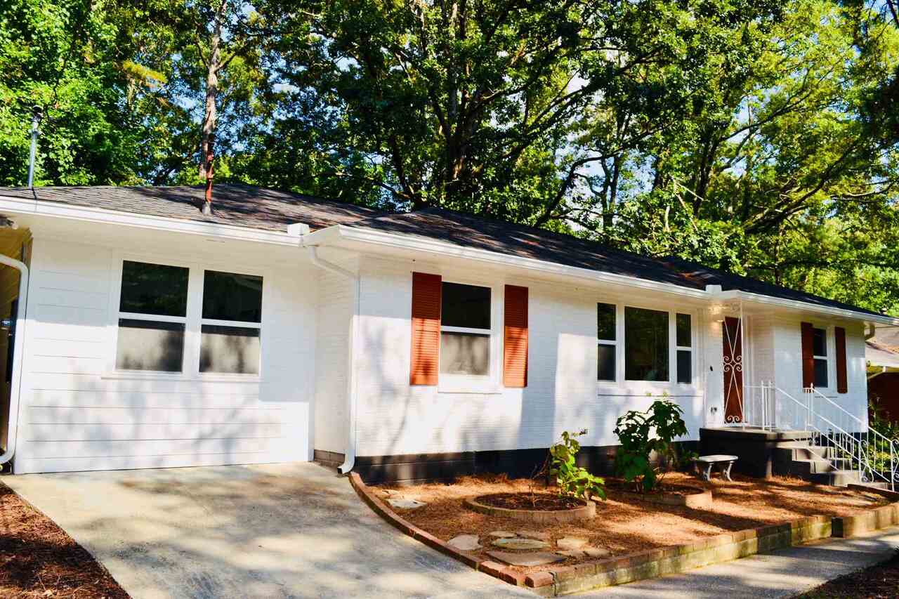 2456 Springdale Road Southwest Atlanta, GA 30315 - Photo 1 of 1 a front view of a house with yard