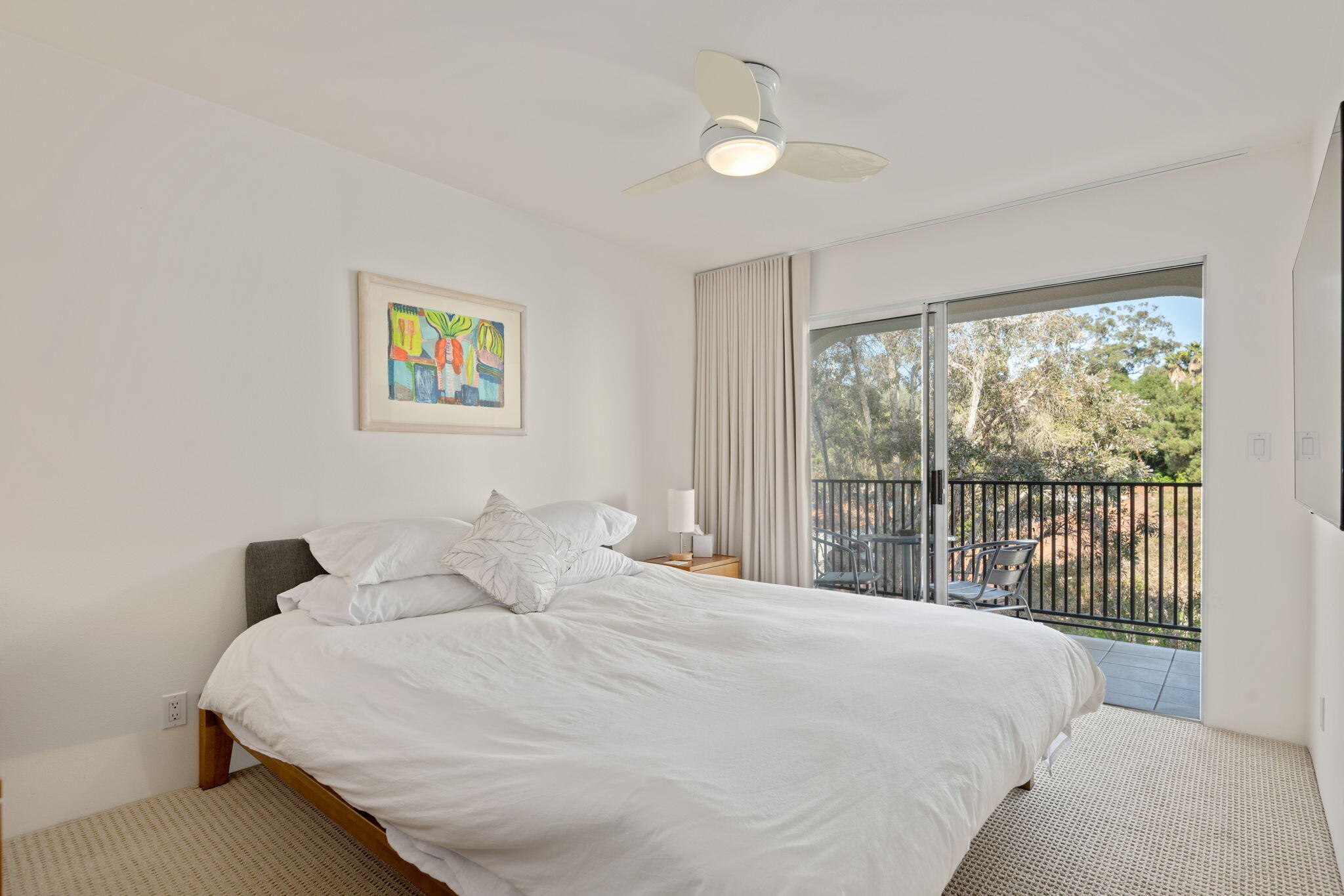 269 Por La Mar Circle Santa Barbara, CA 93103 - Photo 16 of 26 a bedroom with a bed and a large window