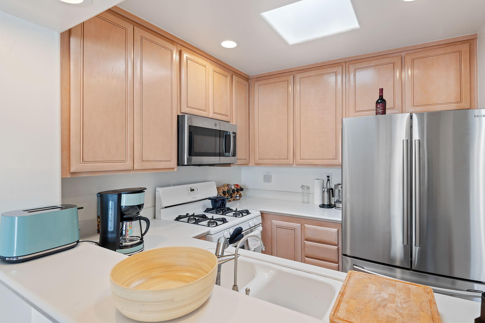 269 Por La Mar Circle Santa Barbara, CA 93103 - Photo 8 of 26 a kitchen with stainless steel appliances granite countertop a refrigerator sink and cabinets
