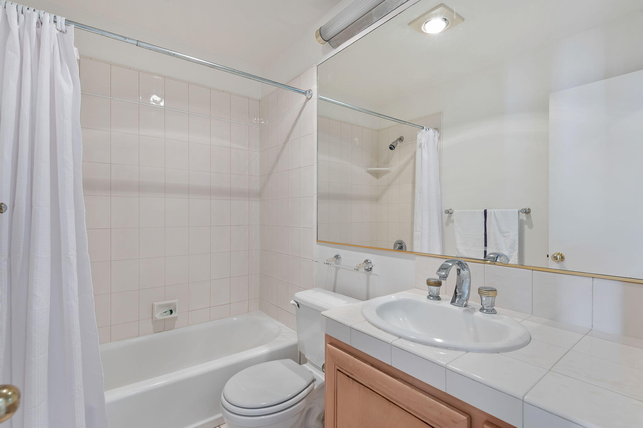 269 Por La Mar Circle Santa Barbara, CA 93103 - Photo 10 of 26 a bathroom with a granite countertop sink toilet and shower