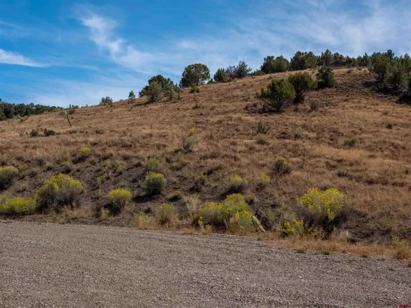 a view of mountains with sunset