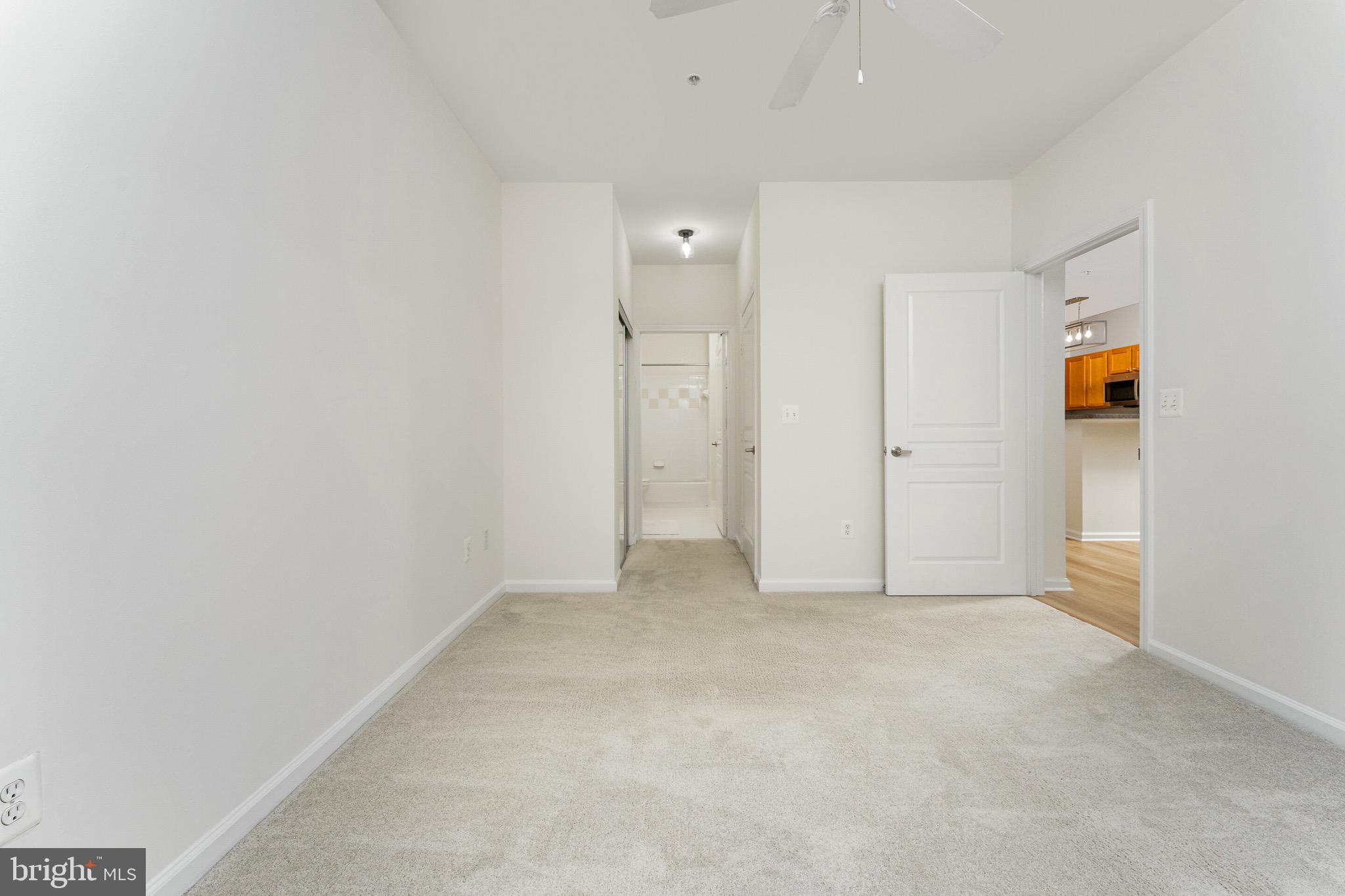 12000 Market Street, Unit 244 Reston, VA 20190 - Photo 16 of 54 Hall to closets and bath