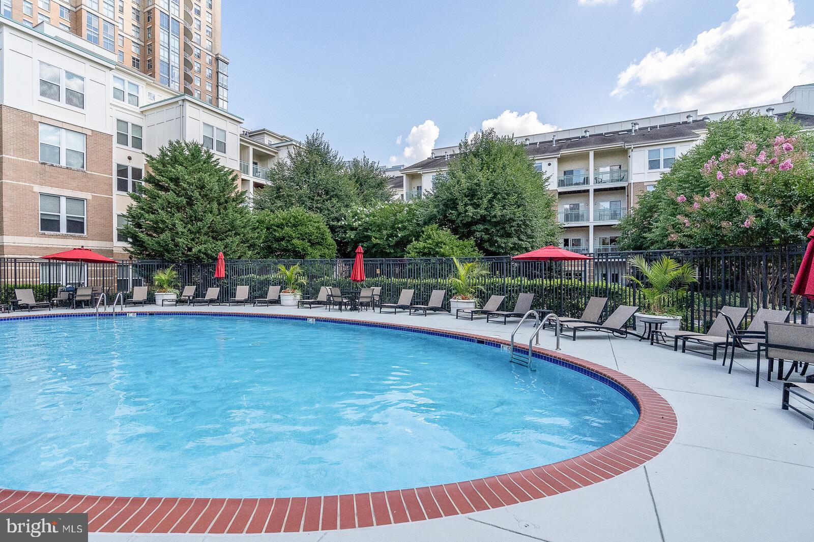 12000 Market Street, Unit 244 Reston, VA 20190 - Photo 28 of 54 Luxury outdoor pool to enjoy during the season