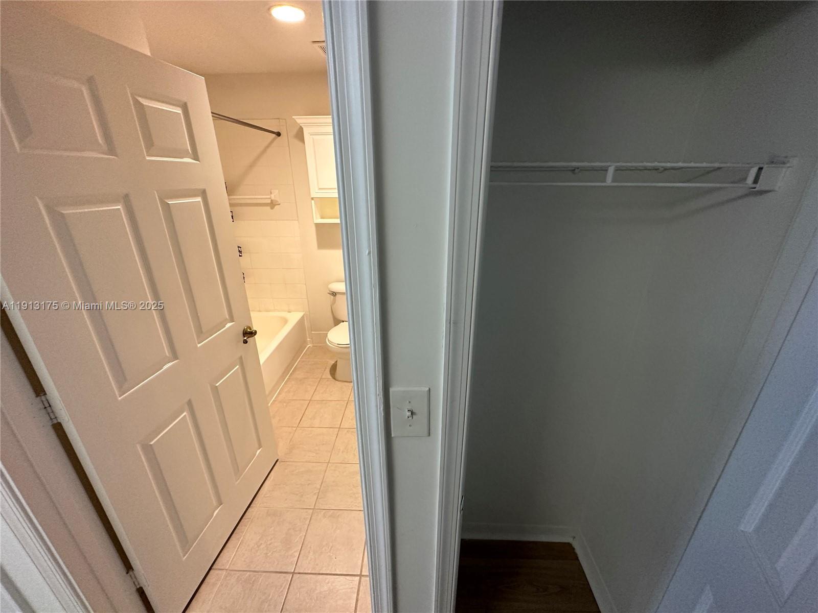 1200 Town Center Drive, Unit 217 Jupiter, FL 33458 - Photo 12 of 37 a view of a bathroom from a corridor