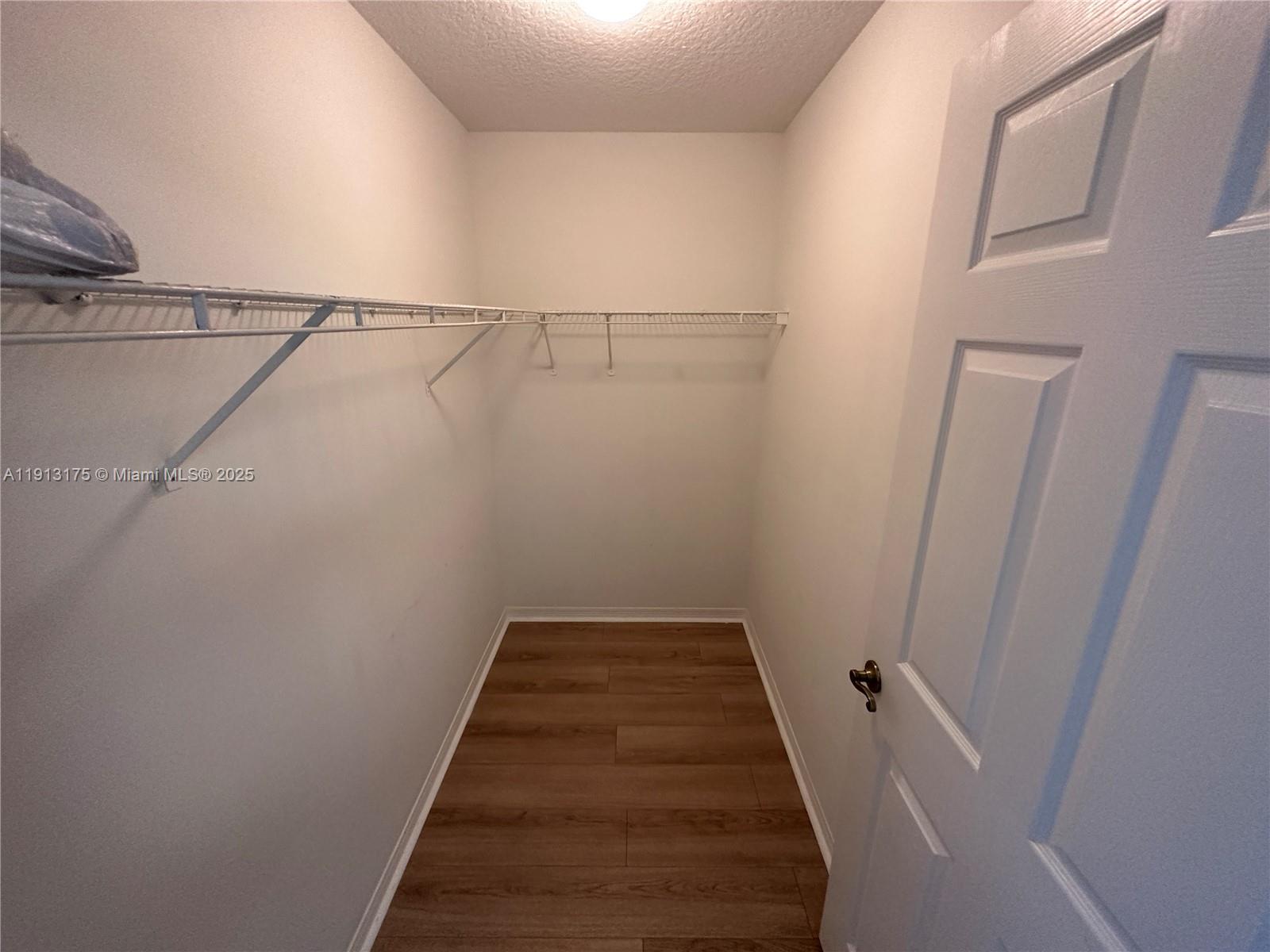 1200 Town Center Drive, Unit 217 Jupiter, FL 33458 - Photo 14 of 37 a view of a room with racks on the wall