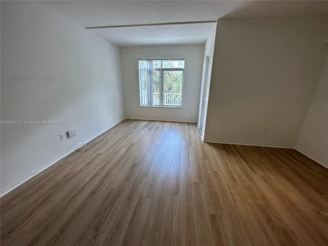 a kitchen with cabinets and white appliances