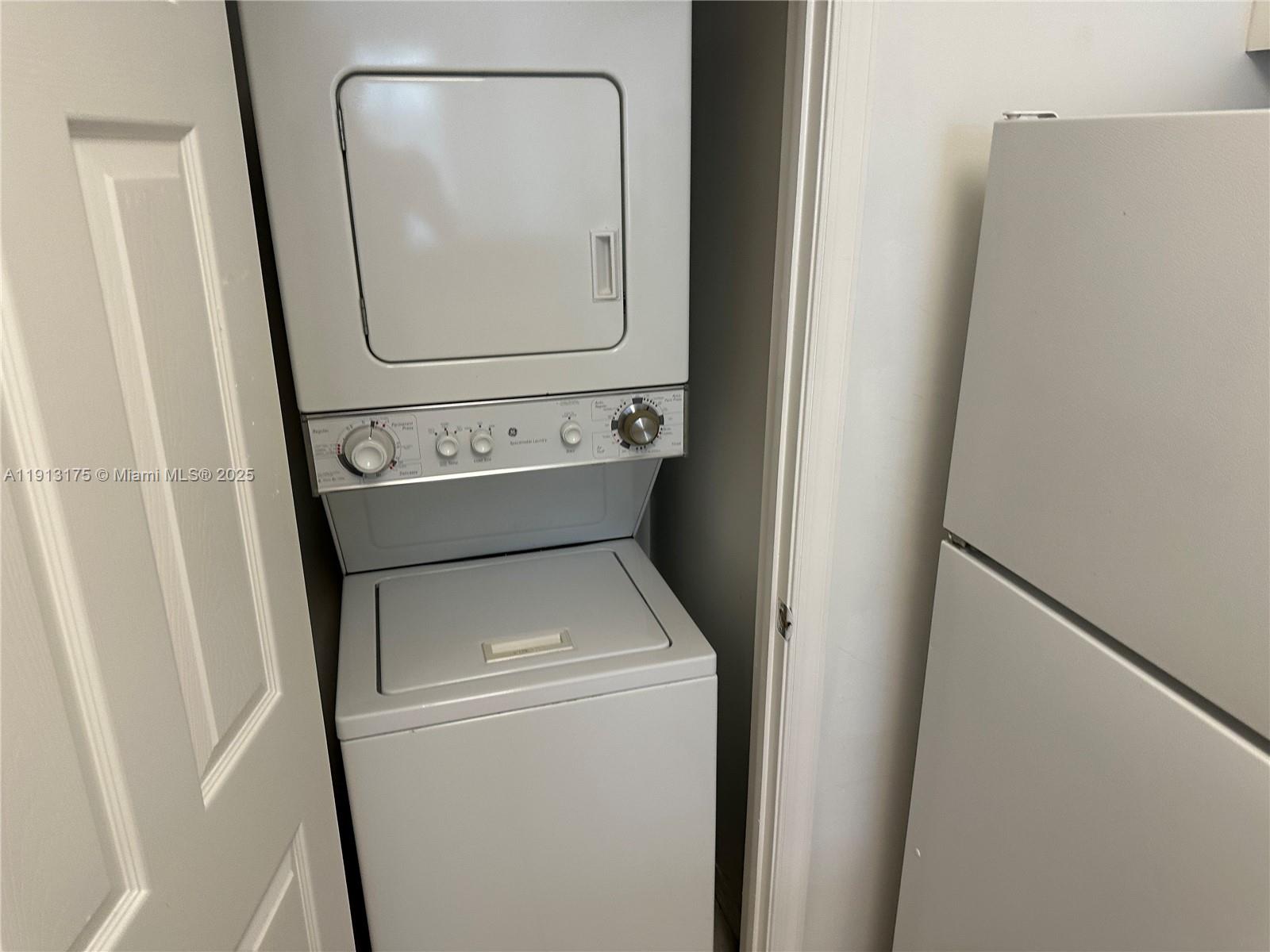 1200 Town Center Drive, Unit 217 Jupiter, FL 33458 - Photo 19 of 37 a utility room with dryer and washer