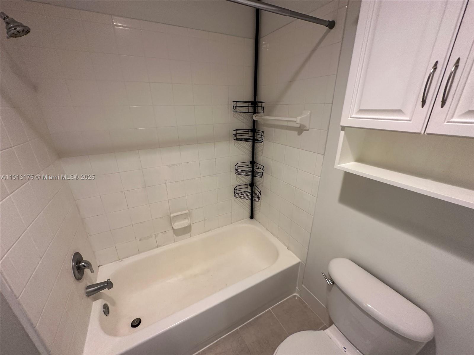 1200 Town Center Drive, Unit 217 Jupiter, FL 33458 - Photo 23 of 37 a bathroom with a sink a toilet and shower