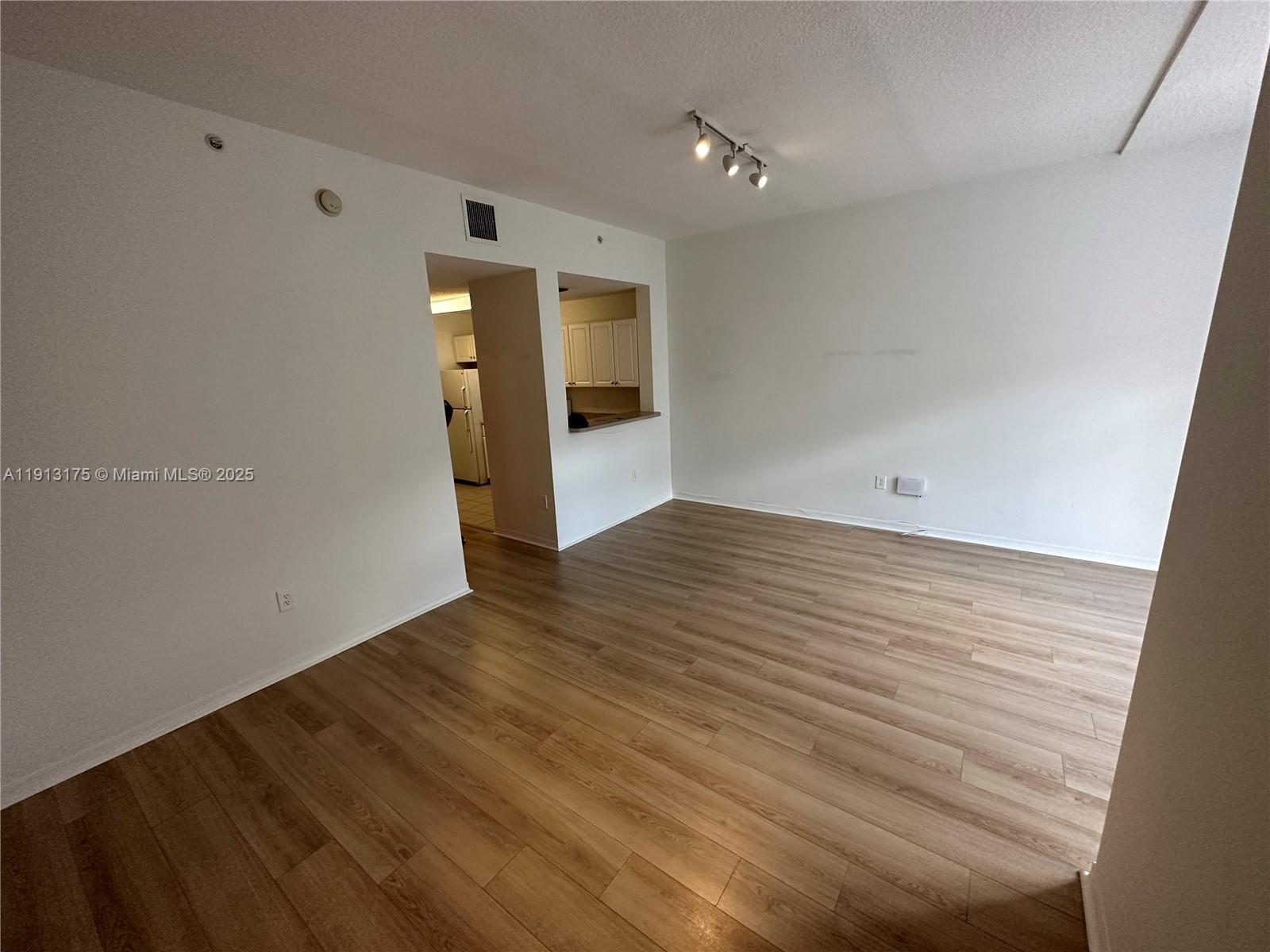 1200 Town Center Drive, Unit 217 Jupiter, FL 33458 - Photo 25 of 37 wooden floor in an empty room