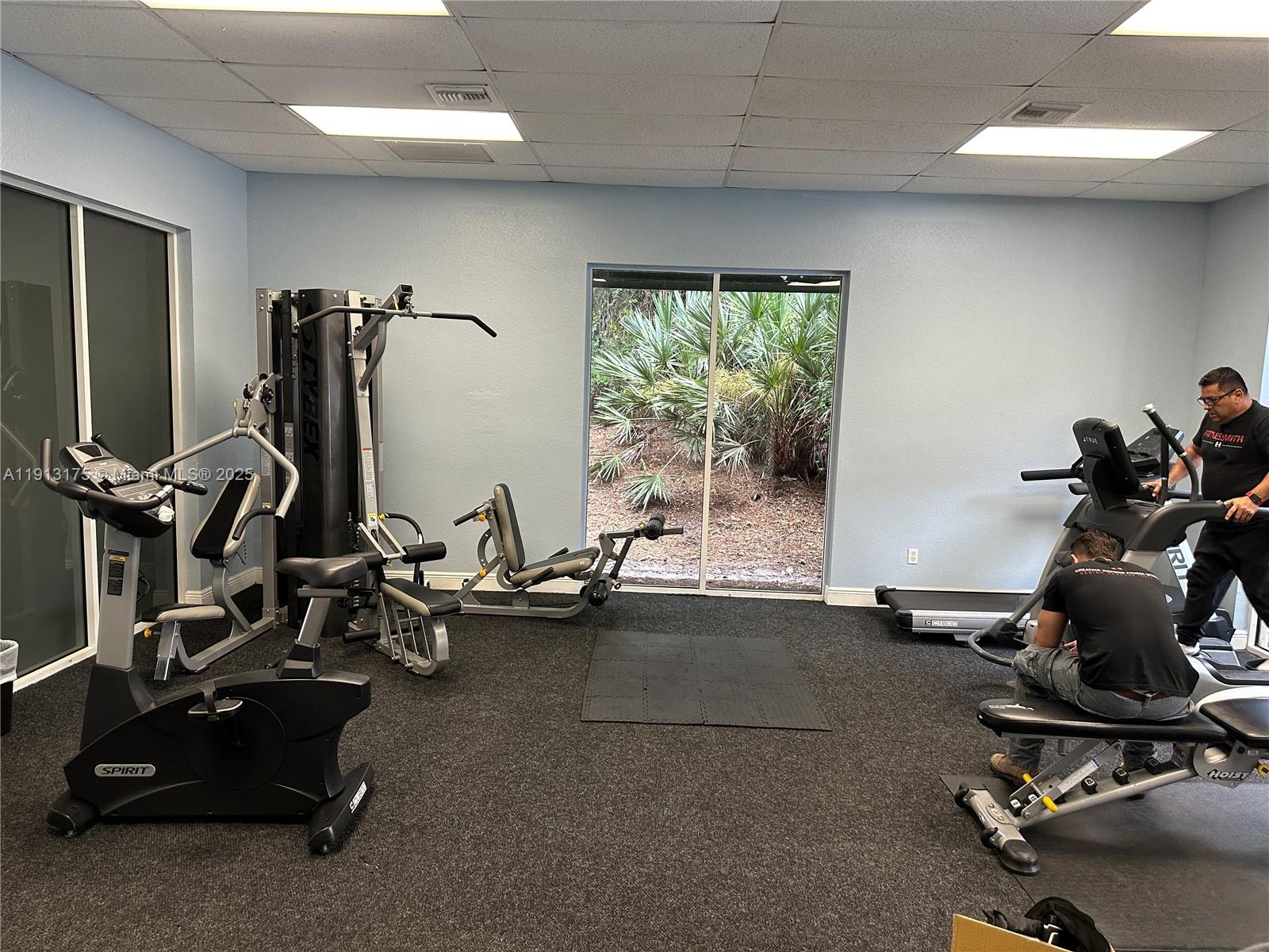 1200 Town Center Drive, Unit 217 Jupiter, FL 33458 - Photo 34 of 37 a view of a room with gym equipment