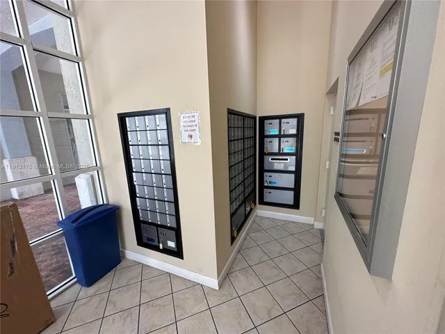 a view of an empty room with a staircase