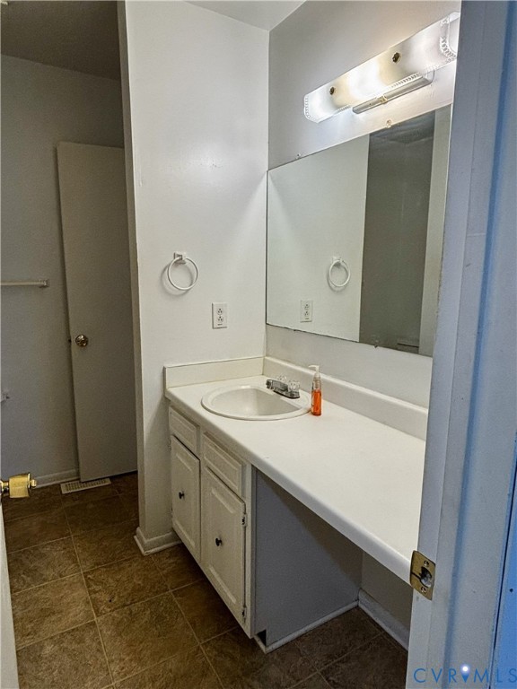 3860 Governors Way Virginia Beach, VA 23452 - Photo 16 of 22 a bathroom with a sink and a mirror