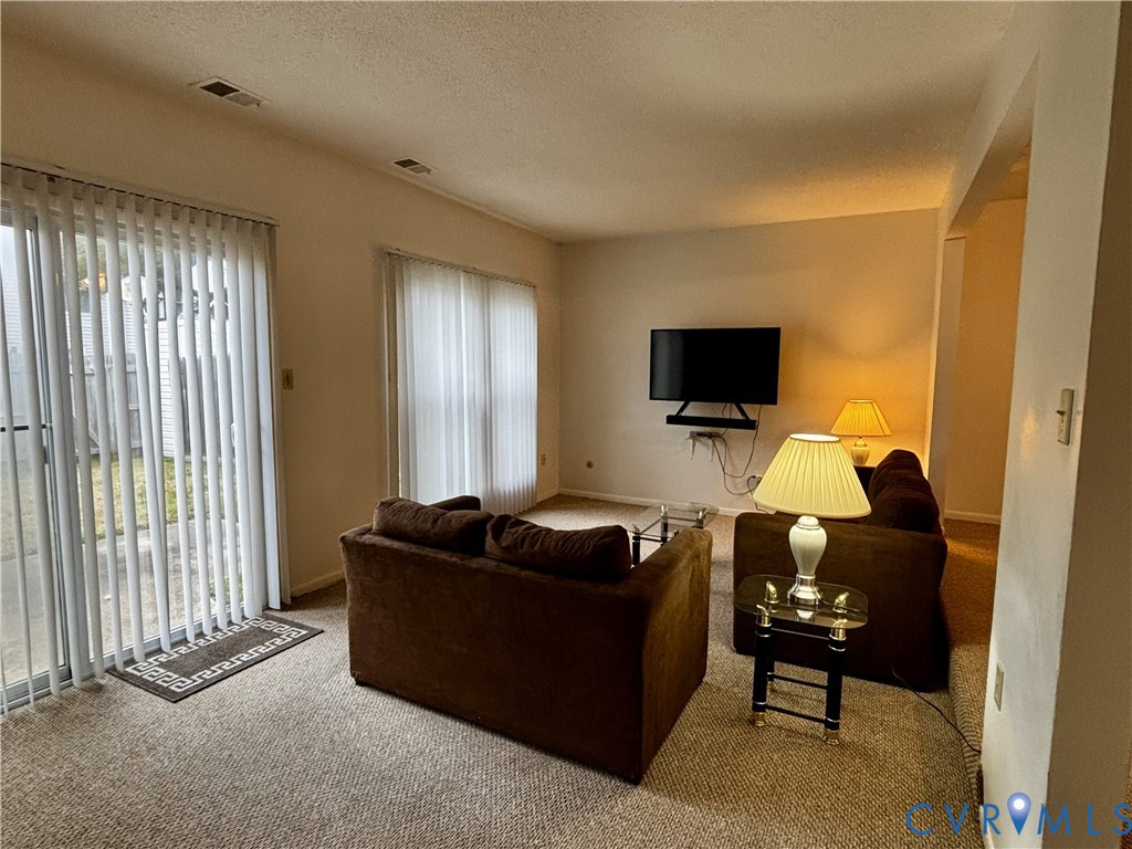 3860 Governors Way Virginia Beach, VA 23452 - Photo 10 of 22 a living room with furniture and a flat screen tv