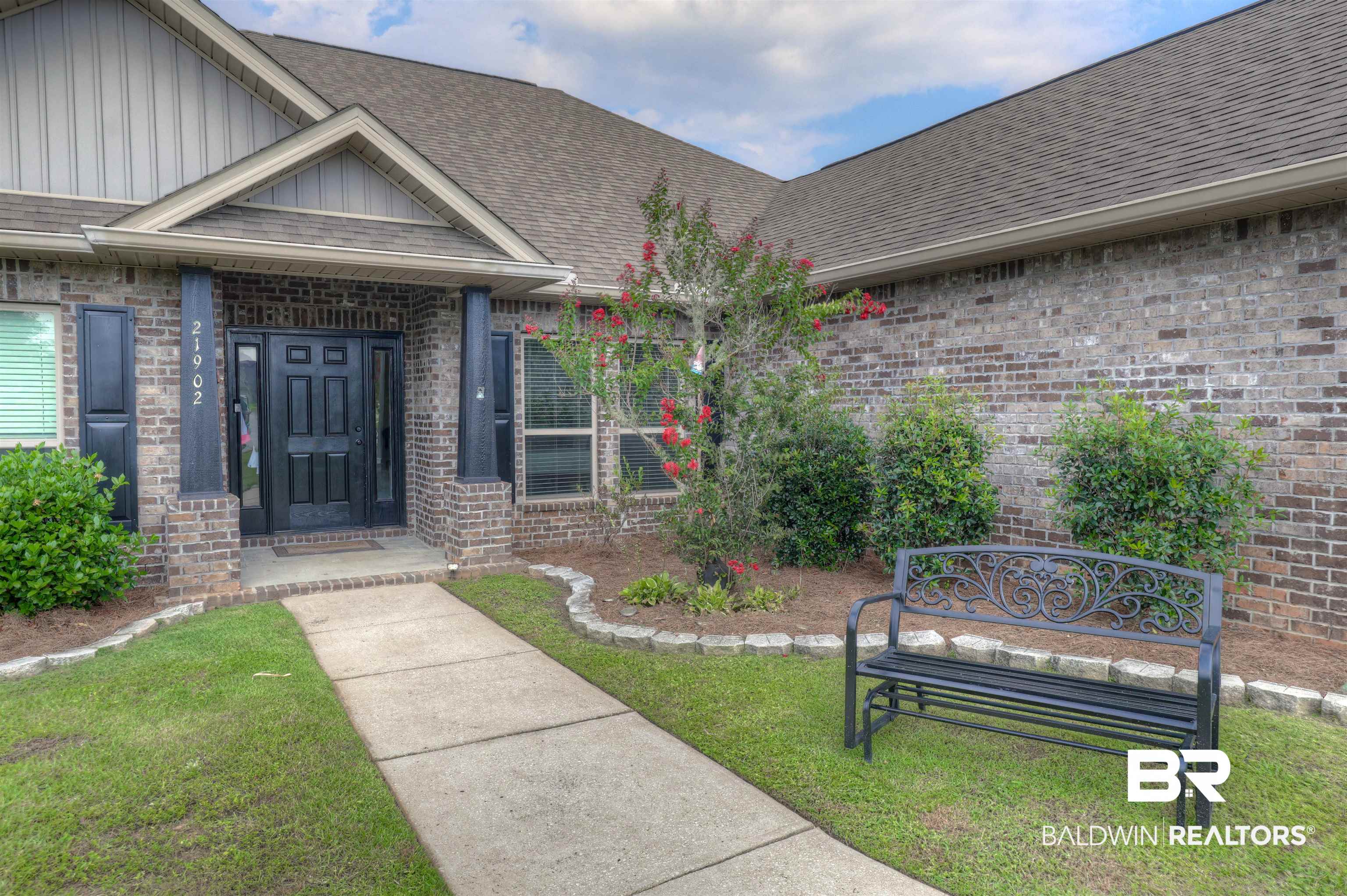 21902 Yosemite Boulevard Fairhope, AL 36532 - Photo 2 of 32 View of exterior entry with a yard