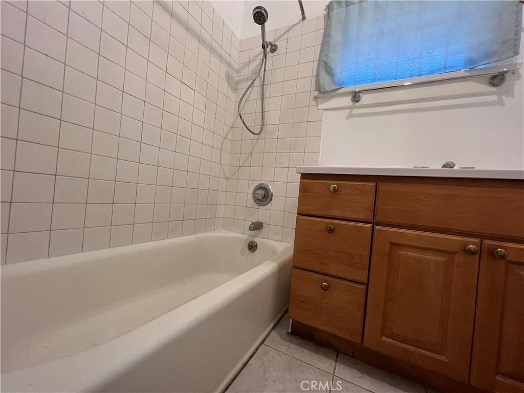 8051 Hellman Avenue Rosemead, CA 91770 - Photo 9 of 18 a bathroom with a bathtub and shower