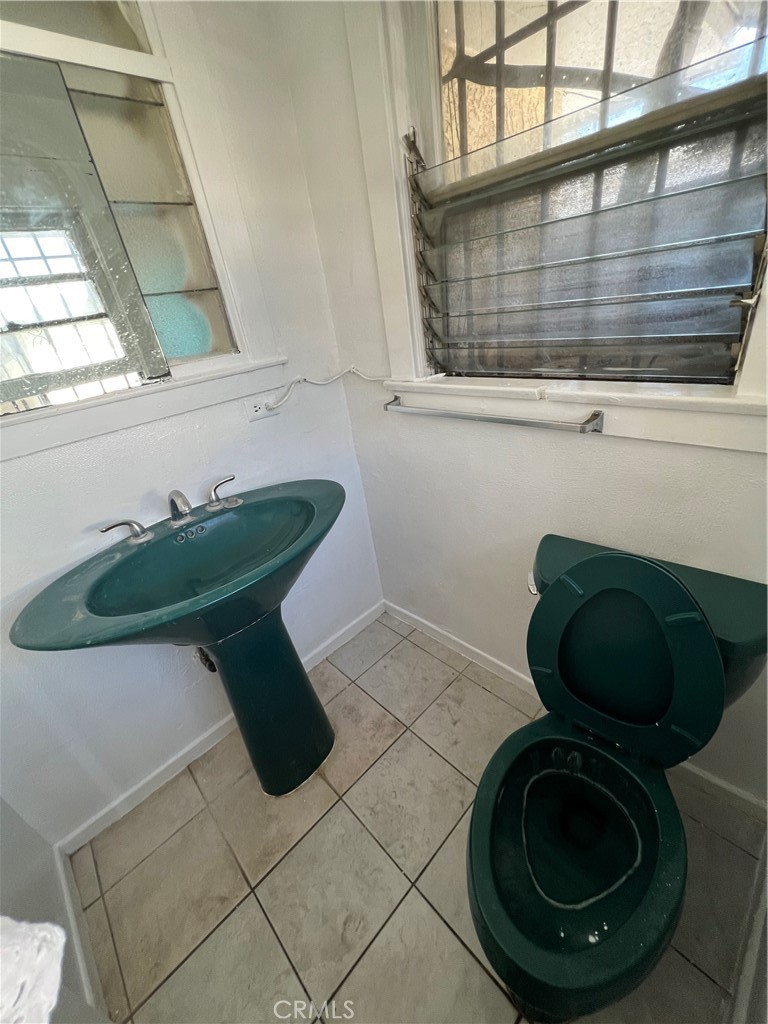 8051 Hellman Avenue Rosemead, CA 91770 - Photo 10 of 18 a bathroom with a toilet and a sink