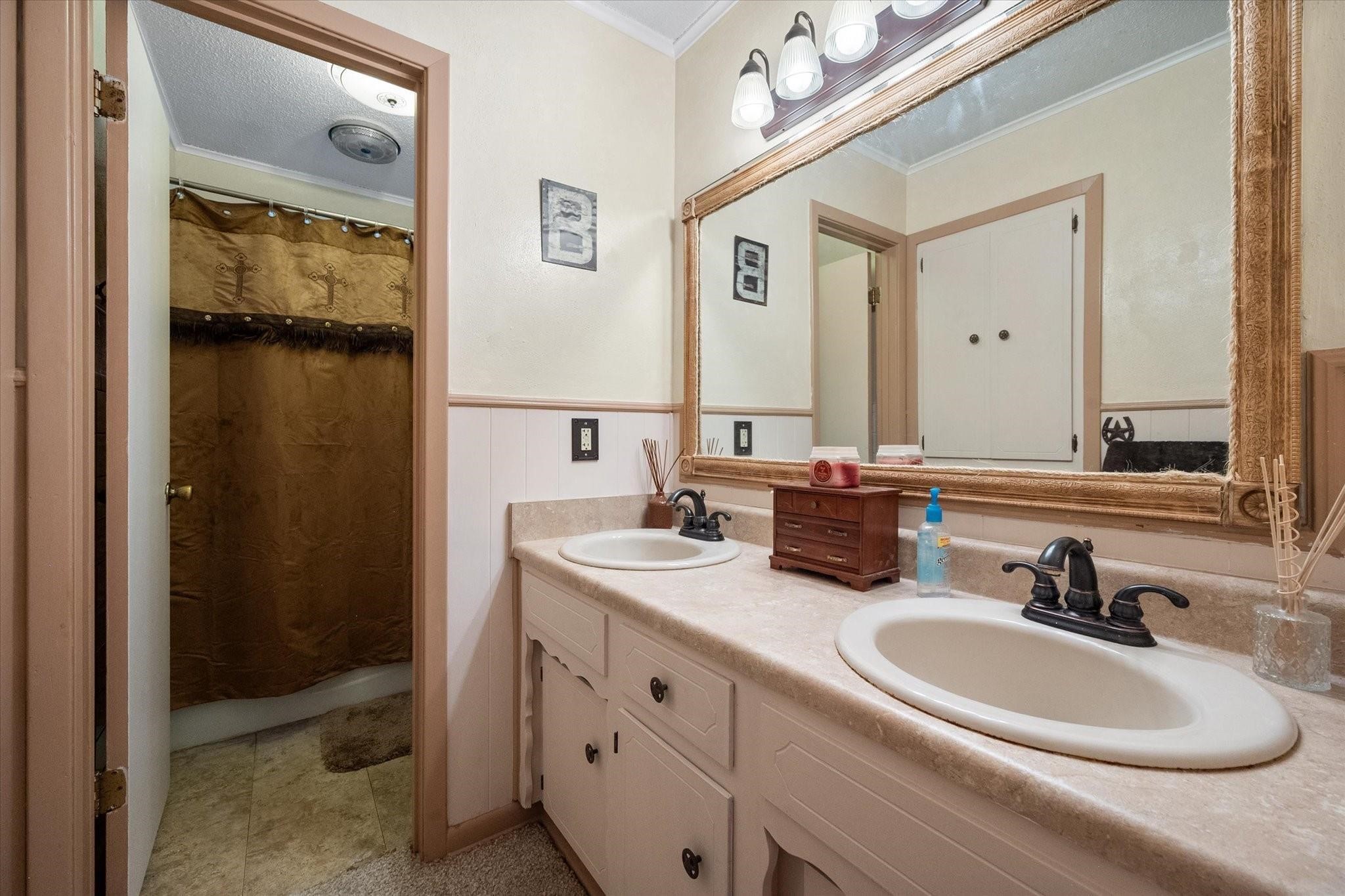 230 Freestone County Road, Unit 141 Streetman, TX 75859 - Photo 15 of 40 a bathroom with a sink and a mirror