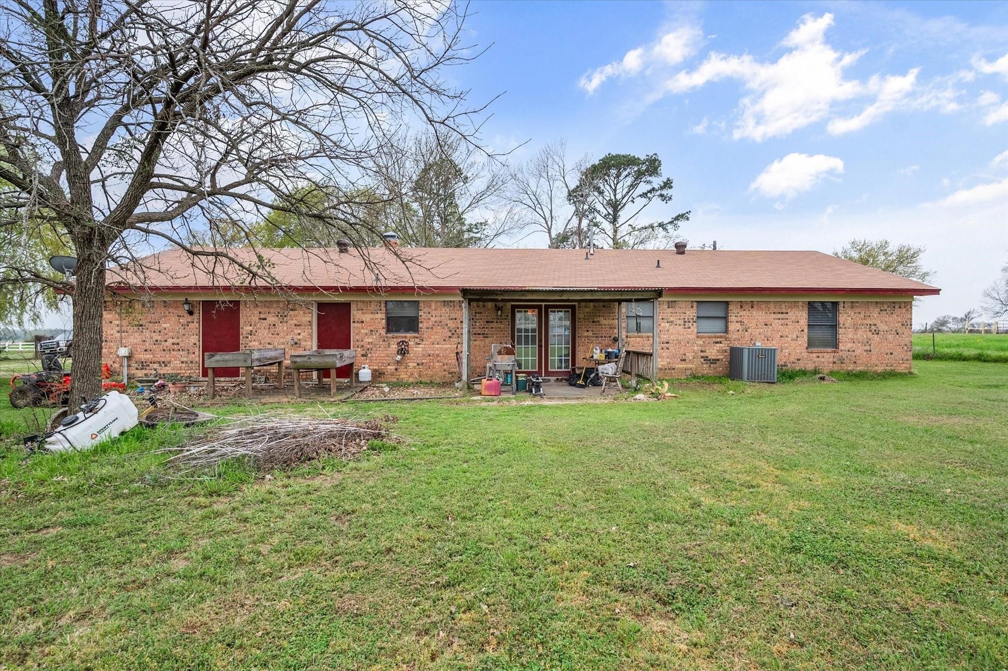 230 Freestone County Road, Unit 141 Streetman, TX 75859 - Photo 18 of 40 a front view of a house with swimming pool having outdoor seating