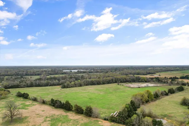 an aerial view of a houses with outdoor space