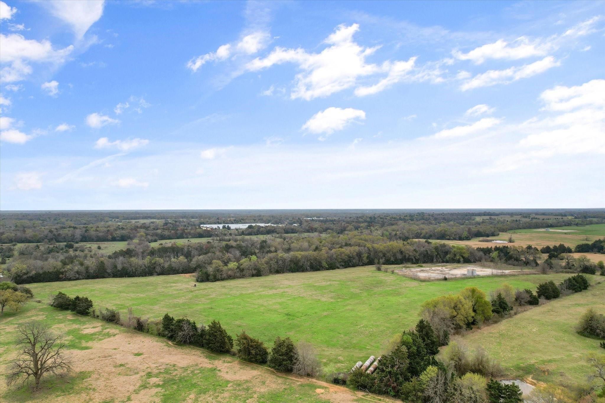 230 Freestone County Road, Unit 141 Streetman, TX 75859 - Photo 23 of 40 an aerial view of a houses with outdoor space