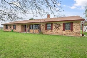 230 Freestone County Road, Unit 141 Streetman, TX 75859 - Photo 29 of 40 a view of a house with a backyard