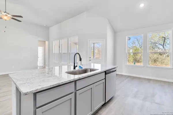 a kitchen with sink and window