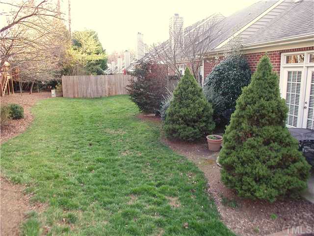 8730 Compass Lane Raleigh, NC 27615 - Photo 14 of 21 There is a spacious lawn behind the townhomes, too.