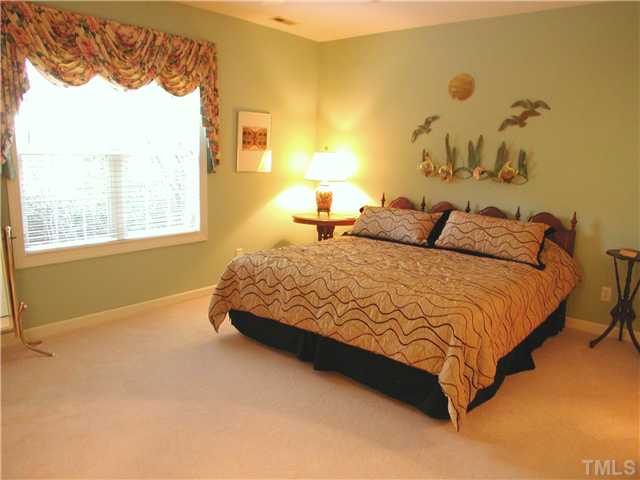 8730 Compass Lane Raleigh, NC 27615 - Photo 6 of 21 Large main floor master suite has high ceilings, a walk-in closet...