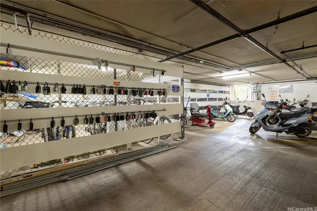 a view of a garage with cars