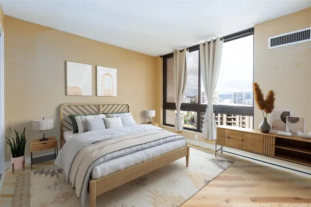 a spacious bedroom with a large bed and a large window