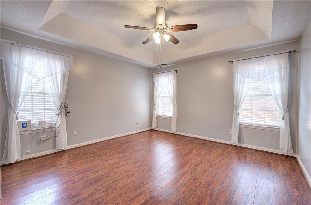 25 Haley Place, Unit 3 Cartersville, GA 30121 - Photo 18 of 45 a view of an empty room with wooden floor and a window