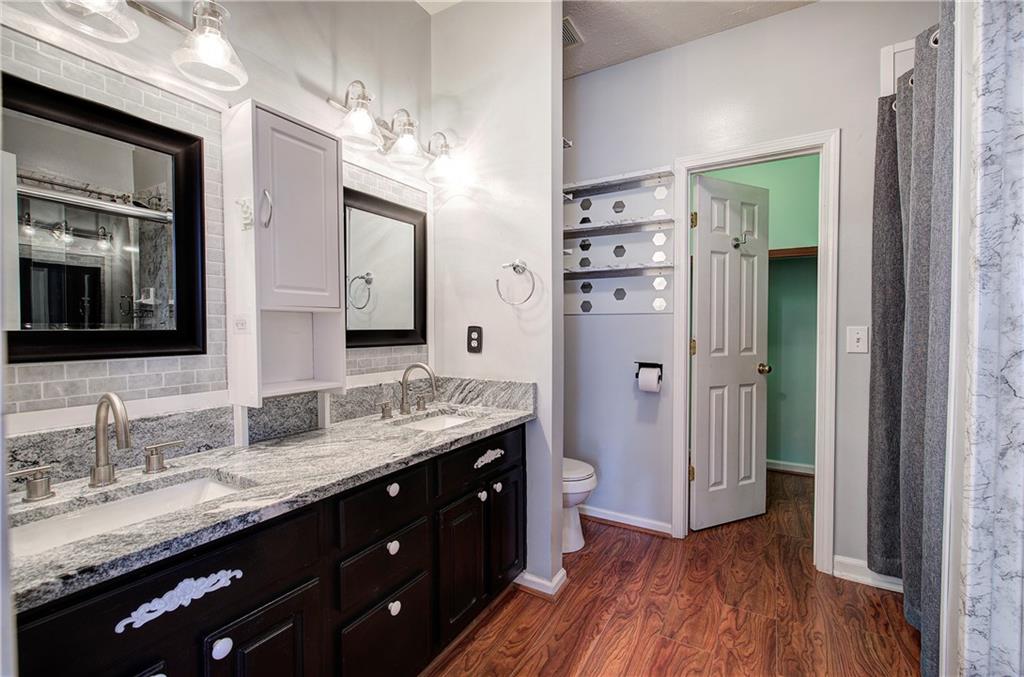 25 Haley Place, Unit 3 Cartersville, GA 30121 - Photo 20 of 45 a bathroom with a granite countertop double vanity sink and mirror