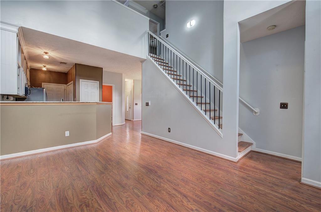25 Haley Place, Unit 3 Cartersville, GA 30121 - Photo 23 of 45 a view of a hallway with wooden floor and staircase