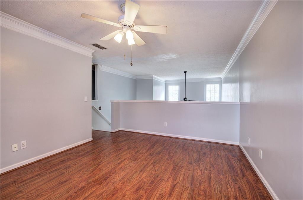 25 Haley Place, Unit 3 Cartersville, GA 30121 - Photo 25 of 45 an empty room with wooden floor and windows