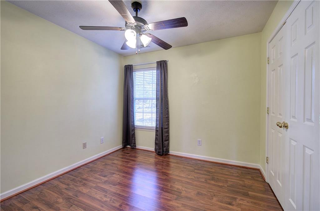 25 Haley Place, Unit 3 Cartersville, GA 30121 - Photo 29 of 45 wooden floor in an empty room with a window