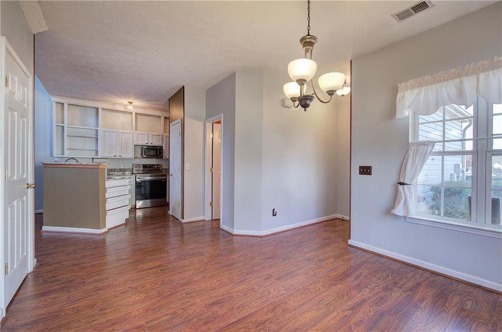 25 Haley Place, Unit 3 Cartersville, GA 30121 - Photo 5 of 45 a view of a kitchen with a stove cabinets and wooden floor