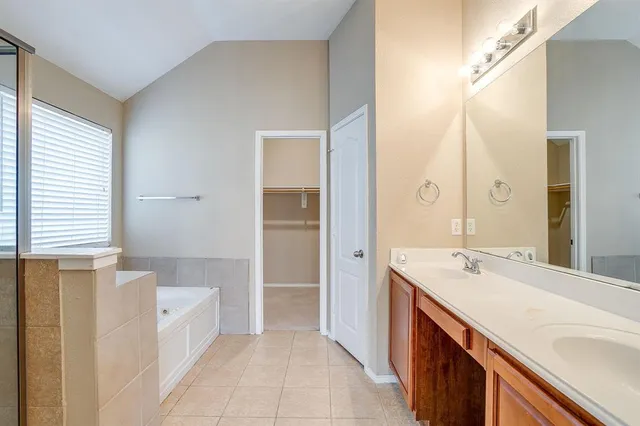 a white bath tub sitting next to a window