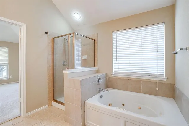 a bathroom with a sink double vanity and a mirror