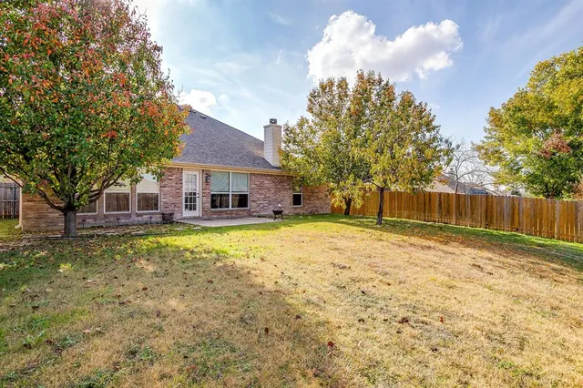 a view of a terrace with swimming pool and furniture