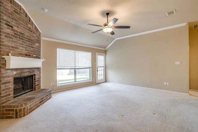 a view of a kitchen with stainless steel appliances granite countertop a refrigerator and a sink