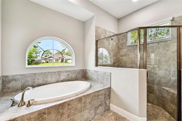 a bath tub sitting next to a window