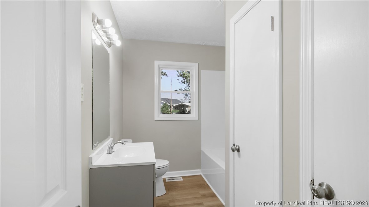 6114 Sandy Creek Road Stedman, NC 28391 - Photo 14 of 34 a bathroom with a sink and a mirror