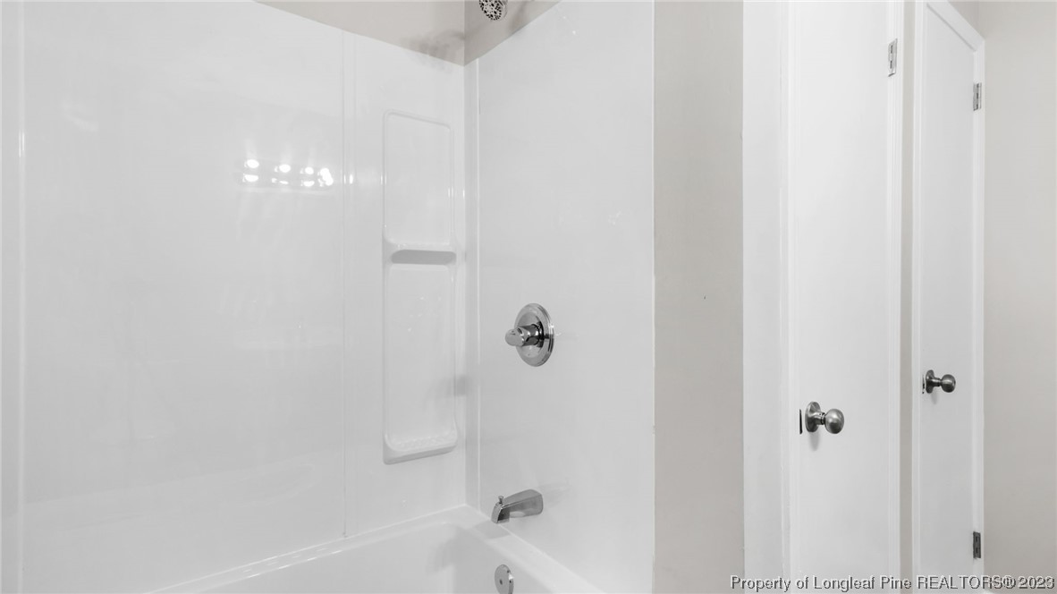 6114 Sandy Creek Road Stedman, NC 28391 - Photo 16 of 34 a bathroom with a shower