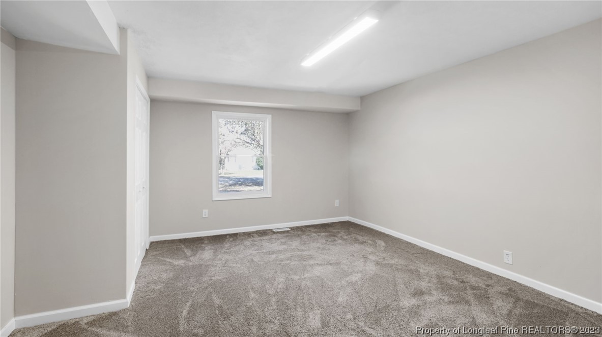 6114 Sandy Creek Road Stedman, NC 28391 - Photo 19 of 34 a view of an empty room with a window