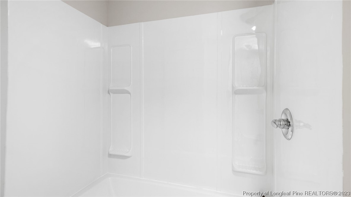 6114 Sandy Creek Road Stedman, NC 28391 - Photo 23 of 34 a bathroom with a shower