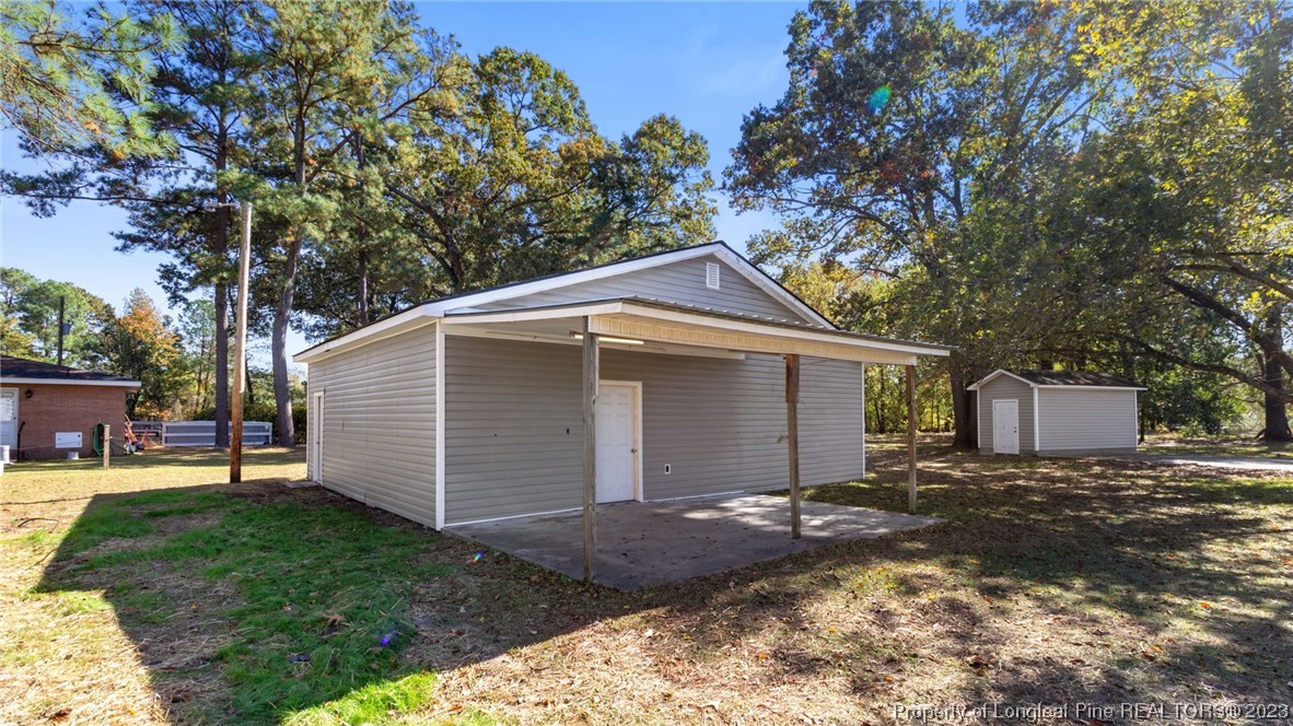 6114 Sandy Creek Road Stedman, NC 28391 - Photo 27 of 34 a view of a house with a yard