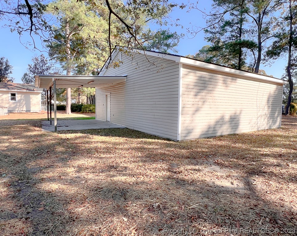 6114 Sandy Creek Road Stedman, NC 28391 - Photo 28 of 34 a view of a house with a yard