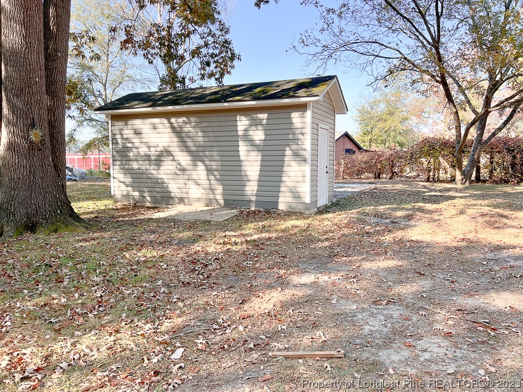 6114 Sandy Creek Road Stedman, NC 28391 - Photo 31 of 34 a view of a house with a yard