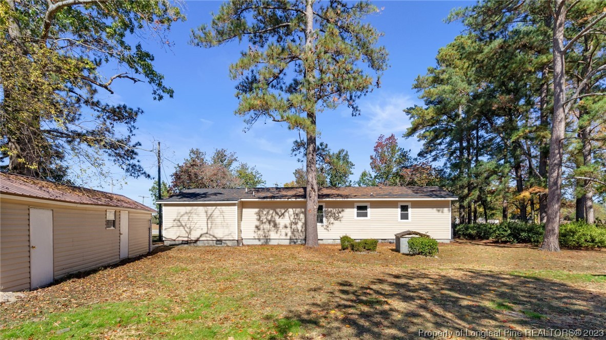 6114 Sandy Creek Road Stedman, NC 28391 - Photo 33 of 34 a view of a house with a tree in the background